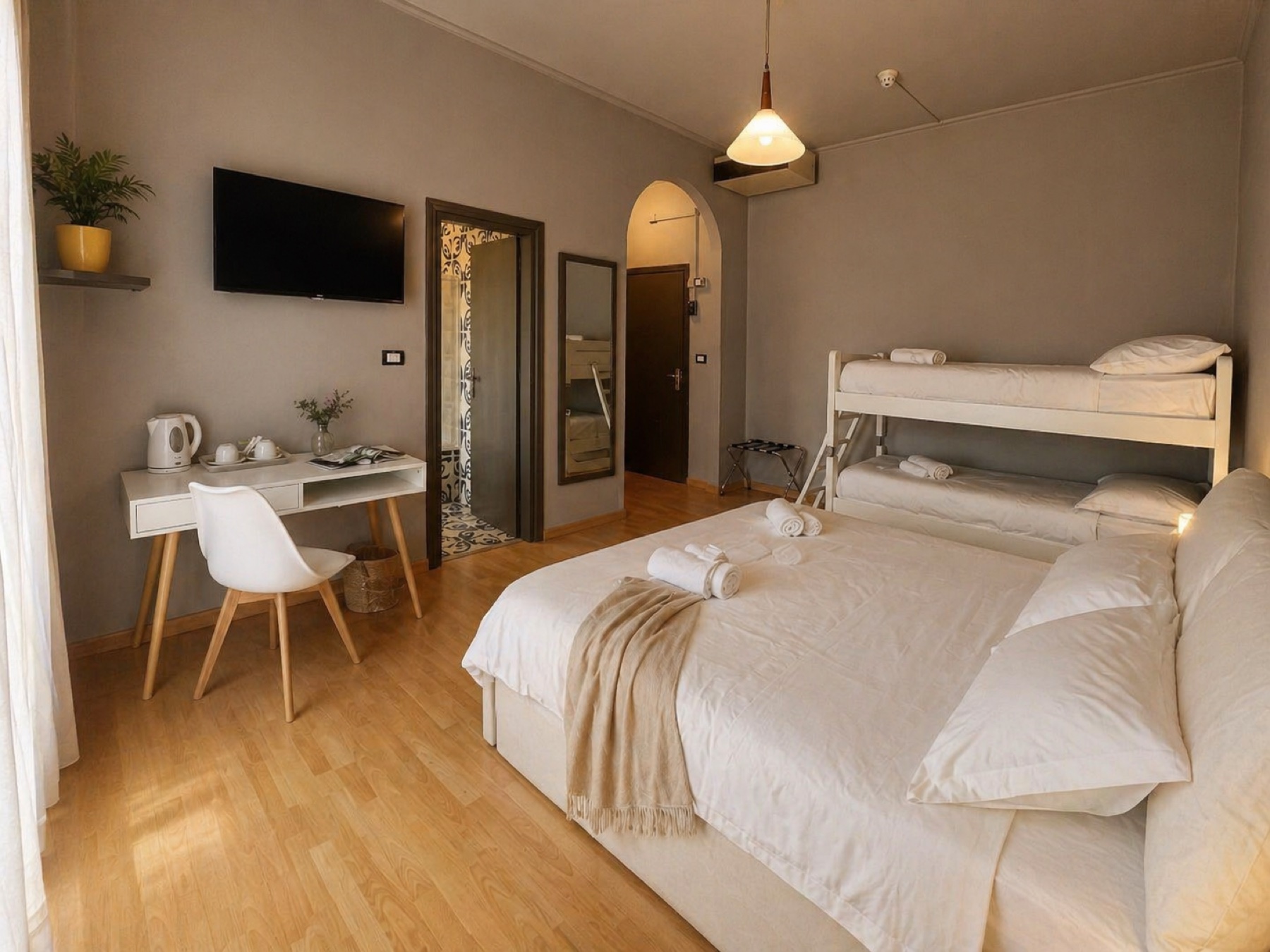 Room with double bed, desk and kettle